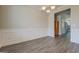 Bright dining room showcases wainscoting and wood floors, perfect for entertaining at 116 Sophie Cir, Locust Grove, GA 30248