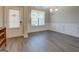 Elegant dining room with wainscoting, gray flooring, and a chandelier at 116 Sophie Cir, Locust Grove, GA 30248