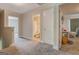 Open hallway showcasing access to a bathroom and flexible space for various needs at 116 Sophie Cir, Locust Grove, GA 30248