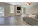 Cozy living room with ample natural light and a modern fireplace at 116 Sophie Cir, Locust Grove, GA 30248