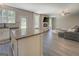 Open concept living space with island, seamlessly connecting the kitchen and living area at 116 Sophie Cir, Locust Grove, GA 30248