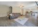Open concept living room showcasing a spacious layout and modern kitchen with white cabinetry at 116 Sophie Cir, Locust Grove, GA 30248