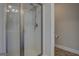 Modern shower featuring sleek glass door and contemporary fixtures at 116 Sophie Cir, Locust Grove, GA 30248