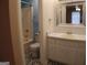 Well-lit bathroom featuring modern fixtures, a bathtub and contemporary design at 2498 Robinhood Dr, Ellenwood, GA 30294