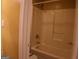 Bathroom area showcasing a white shower-tub combo surrounded by white walls at 2498 Robinhood Dr, Ellenwood, GA 30294