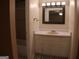 Bathroom showcasing a vanity with a sink, mirror and patterned tile flooring at 2498 Robinhood Dr, Ellenwood, GA 30294