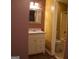 Bathroom featuring wood flooring, sink with vanity, and a toilet and shower area at 2498 Robinhood Dr, Ellenwood, GA 30294
