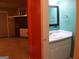 Half bath with a sink and vanity. Next to the basement living area at 2498 Robinhood Dr, Ellenwood, GA 30294