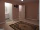 Bedroom featuring patterned carpet, beige walls and a bathroom at 2498 Robinhood Dr, Ellenwood, GA 30294