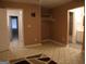 Spacious bedroom with a closet, an adjacent bathroom and neutral walls and a unique carpet at 2498 Robinhood Dr, Ellenwood, GA 30294