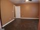 Spacious bedroom with wood flooring, large closet, and a ceiling fan, offering a comfortable and inviting space at 2498 Robinhood Dr, Ellenwood, GA 30294