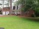 Beautiful two-story home with well-kept lawn and lush trees, creating a serene and inviting atmosphere at 2498 Robinhood Dr, Ellenwood, GA 30294