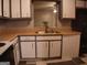 Kitchen with white cabinets, light-toned countertops and decorative backsplash at 2498 Robinhood Dr, Ellenwood, GA 30294