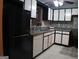 Well-equipped kitchen featuring white cabinets, tiled backsplash and a stainless steel refrigerator at 2498 Robinhood Dr, Ellenwood, GA 30294