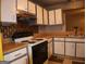 Kitchen with white cabinets, light-toned countertops and decorative backsplash at 2498 Robinhood Dr, Ellenwood, GA 30294