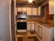 Kitchen with white cabinets, light-toned countertops and a decorative backsplash at 2498 Robinhood Dr, Ellenwood, GA 30294