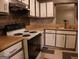 Kitchen with white cabinets, light-toned countertops and decorative backsplash at 2498 Robinhood Dr, Ellenwood, GA 30294