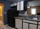 Stylish kitchen with stainless steel appliances, cabinets and modern countertops at 2498 Robinhood Dr, Ellenwood, GA 30294
