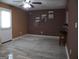 A spacious living room with tile flooring, a ceiling fan, and three wall paintings at 2498 Robinhood Dr, Ellenwood, GA 30294