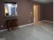Living room with tile flooring, bar stools, and a glimpse of the kitchen through an opening at 2498 Robinhood Dr, Ellenwood, GA 30294
