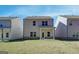 Backyard featuring new grass and a patio for entertaining guests at 4454 Eastbrook Pl # 57B, Snellville, GA 30039