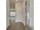 Inviting entryway with wood-look flooring and bright, neutral paint scheme leads into a living space at 4454 Eastbrook Pl # 57B, Snellville, GA 30039