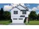 Charming two-story home featuring a white exterior, black shutters, a two-car garage, and well-maintained landscaping at 4454 Eastbrook Pl # 57B, Snellville, GA 30039