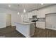 Modern kitchen with stainless appliances, stylish pendant lights, and a convenient island at 4454 Eastbrook Pl # 57B, Snellville, GA 30039