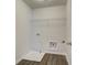 This laundry room offers new floors, shelf, and new hookups at 4454 Eastbrook Pl # 57B, Snellville, GA 30039