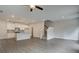 Open living space showcases staircase, eat-in kitchen, and stylish pendant lighting at 4454 Eastbrook Pl # 57B, Snellville, GA 30039