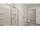 Walk-in shower with built in shelves and easy access to a second bathroom at 1939 Van Allen Ct, Dacula, GA 30019