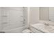 Bathroom with a shower over the tub and vanity with hard-surface countertop at 1939 Van Allen Ct, Dacula, GA 30019