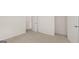 A comfy bedroom features neutral carpet, walk-in closet, and ensuite bathroom at 1939 Van Allen Ct, Dacula, GA 30019