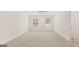 Bright bedroom with neutral carpet, natural light, and ensuite bathroom at 1939 Van Allen Ct, Dacula, GA 30019
