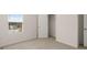 Bright bedroom featuring neutral walls and carpet and a closet at 1939 Van Allen Ct, Dacula, GA 30019