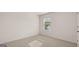 Bright bedroom featuring neutral walls and carpet and a window at 1939 Van Allen Ct, Dacula, GA 30019