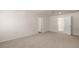 Bedroom with neutral carpet and multiple access doors at 1939 Van Allen Ct, Dacula, GA 30019