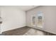 Dining room with luxury vinyl plank flooring, access to a patio, and neutral paint at 1939 Van Allen Ct, Dacula, GA 30019