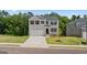 Charming two-story home features a two-car garage, manicured lawn, and a classic brick facade at 1939 Van Allen Ct, Dacula, GA 30019