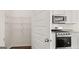 Walk-in pantry with wire shelving and easy kitchen access. Appliances are stainless steel at 1939 Van Allen Ct, Dacula, GA 30019