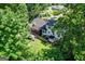 An aerial shot showcasing the house's deck and backyard, and surrounding green landscape at 591 Clubwood Ct, Marietta, GA 30068