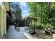 Spacious back deck with outdoor seating, pergola, and lush greenery, perfect for outdoor entertaining at 591 Clubwood Ct, Marietta, GA 30068