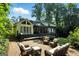 Lovely home exterior with a spacious deck, outdoor seating area, and manicured landscaping, perfect for entertaining at 591 Clubwood Ct, Marietta, GA 30068