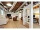 Spacious finished basement with exposed ceiling, a large TV, and a separate office nook at 591 Clubwood Ct, Marietta, GA 30068