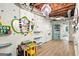Playful finished basement offers versatile space with vibrant decor, storage, and updated flooring at 591 Clubwood Ct, Marietta, GA 30068