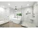 Stylish bathroom with a modern soaking tub, a glass-enclosed shower, and updated fixtures at 591 Clubwood Ct, Marietta, GA 30068
