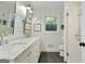 Bright bathroom features a double vanity, subway tile shower, and natural light at 591 Clubwood Ct, Marietta, GA 30068