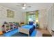 Cozy bedroom with blue accents, playful wallpaper, and ample toy storage at 591 Clubwood Ct, Marietta, GA 30068