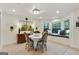 Dining room with a bay window seating area, hardwood floors and stylish decor at 591 Clubwood Ct, Marietta, GA 30068