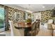 Formal dining room with elegant wallpaper, decorative lighting, and seating for eight at 591 Clubwood Ct, Marietta, GA 30068